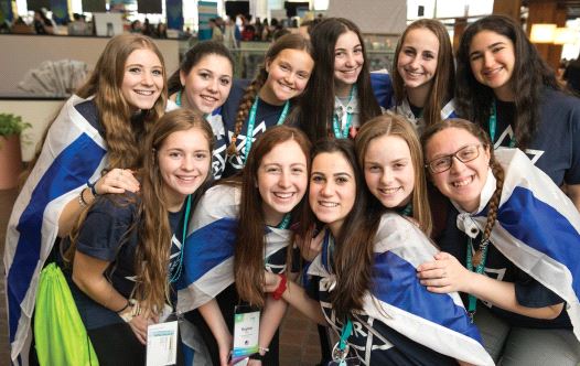 Teenage girls smile while attending the BBYO international convention in Dallas. (credit: JASON DIXSON)