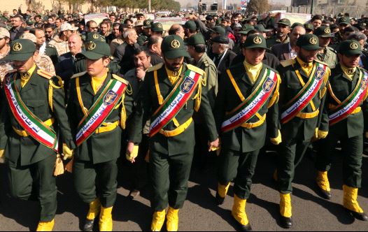 Iranian Revolutionary Guard members in Tehran carry the casket of Iran Revolutionary Guards Brigadier General Mohsen Ghajarian, who was killed in the northern province of Aleppo , Syria  (credit: ATTA KENARE / AFP)