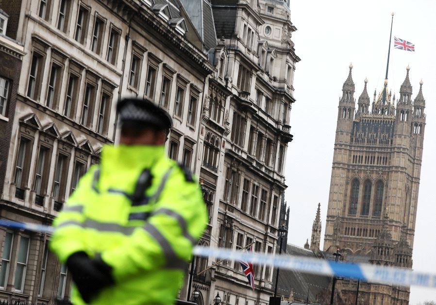 Police officers work at the scene after an attack on Westminster Bridge in London, Britain, March 22, 2017 (credit: REUTERS)