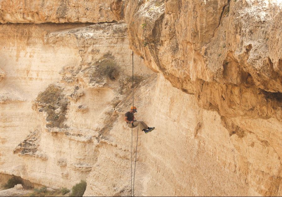 A person rappelling (credit: MARC ISRAEL SELLEM/THE JERUSALEM POST)