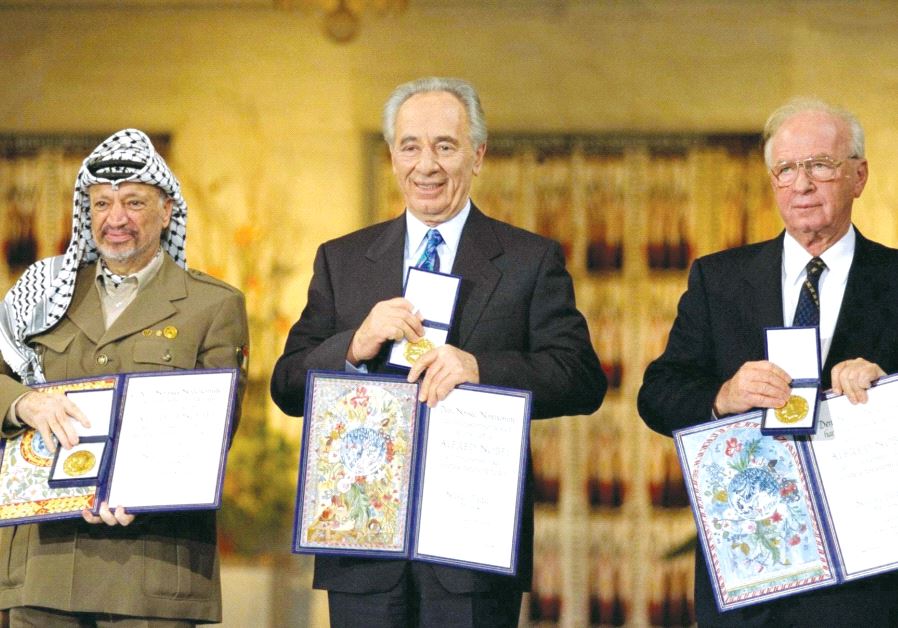 PERES receives the Nobel Peace Prize in Oslo, Norway, in 1994 alongside Yitzhak Rabin and Yasser Arafat. (credit: GPO)