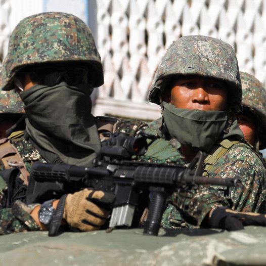 Members of Philippine Marines are pictured aboard a vehicle as more soldiers reinforce to fight the Maute group in Marawi City in southern Philippines May 29, 2017 (credit: REUTERS/ERIK DE CASTRO)