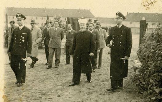 Haj Amin al-Husseini pictured visiting an unnamed German camp during World War II.  (credit: KEDEM AUCTION HOUSE)