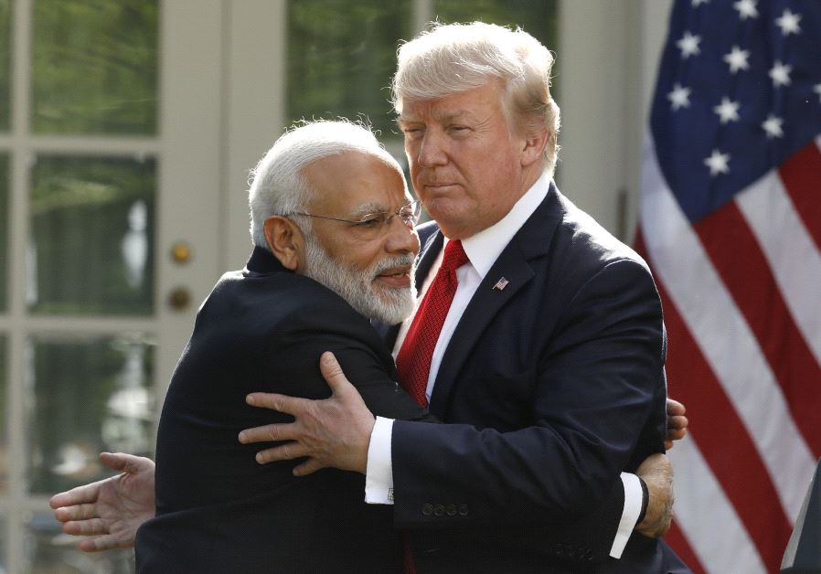 Trump and Modi embrace at the White House, 2017 (credit: KEVIN LAMARQUE/REUTERS)