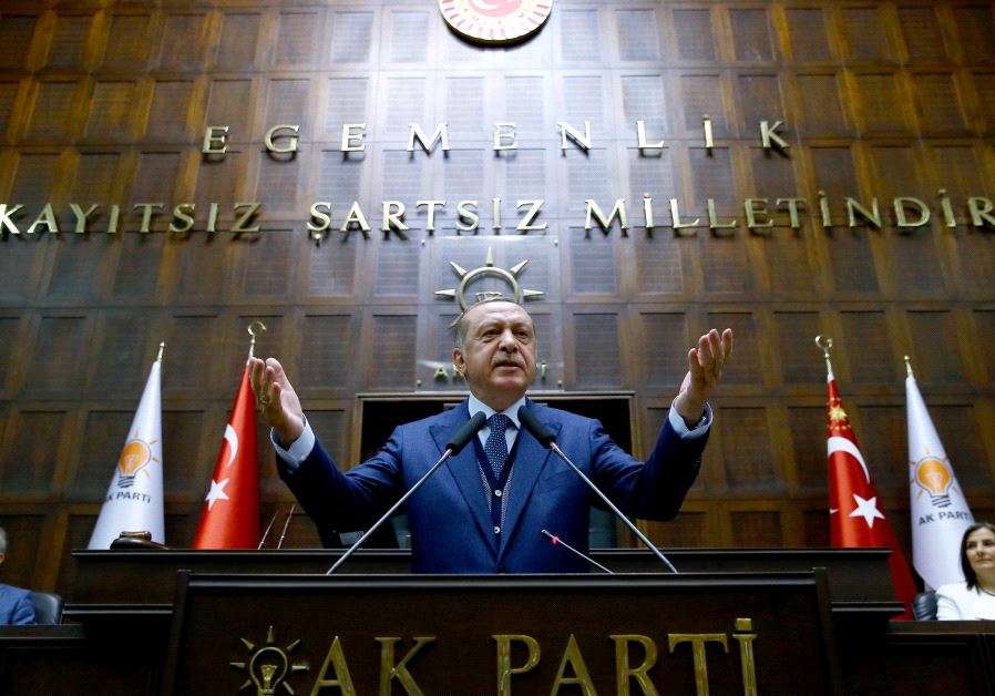 Turkish President Tayyip Erdogan addresses members of parliament from his ruling AK Party (AKP) during a meeting at the Turkish parliament in Ankara, Turkey, June 13, 2017.  (credit: KAYHAN OZER/PRESIDENTIAL PALACE/HANDOUT VIA REUTERS)