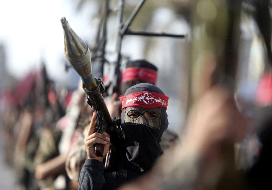 Palestinian members of the Popular Front for the Liberation of Palestine (PFLP) take part in a military show in Gaza  (credit: REUTERS)