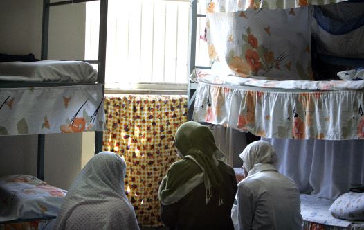 Iranian women prisoners sit at their cell in Tehran's Evin prison June 13, 2006.  (credit: REUTERS)