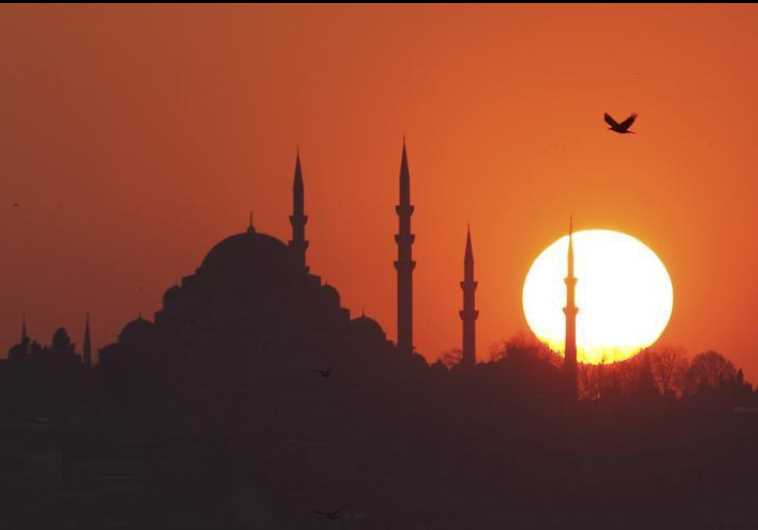 The sun sets over the Ottoman-era Suleymaniye mosque in Istanbul