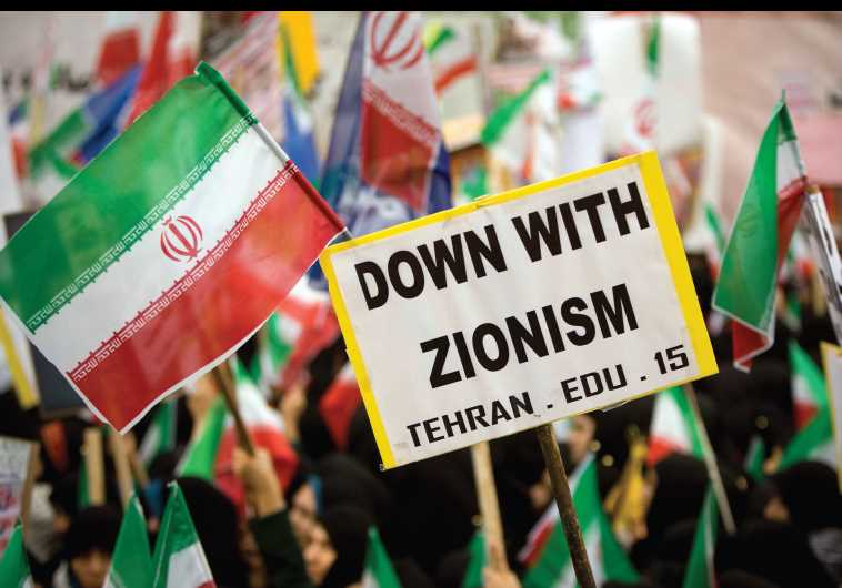 Iranian students hold anti-Israeli placards and Iranian flags during a rally outside the former US embassy in Tehran in 2009