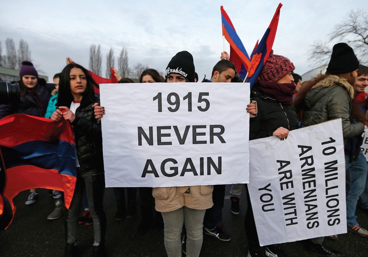 An Armenian protester holds a banner reading ‘1915 never again’ as she takes part in a demonstration near the European Court of Human Rights in Strasbourg in January