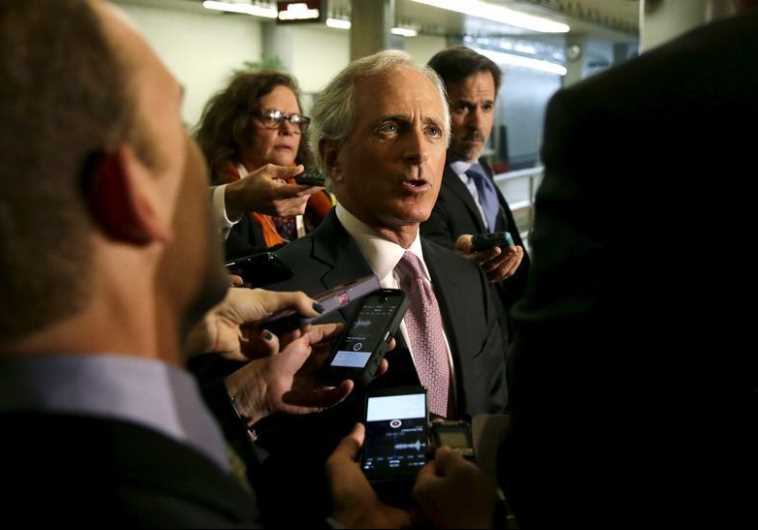 Senate Foreign Relations Committee Chairman Senator Bob Corker (R-TN) (C) talks to reporters on Capitol Hill in Washington