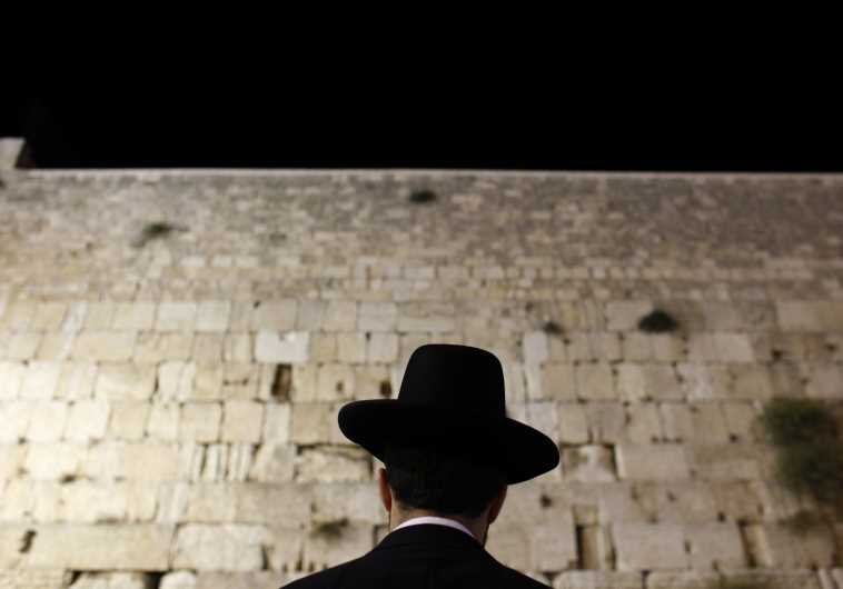An Orthodox Jewish worshipper prays at the Western Wall, Judaism's holiest prayer site, in Jerusalem's Old City