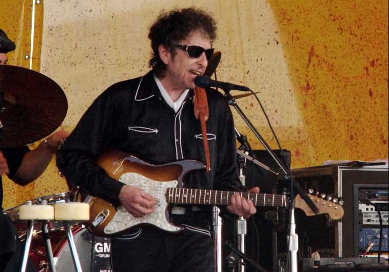 Bob Dylan performs with his band at the 34th annual New Orleans Jazz and Heritage Festival, April 25, 2003. 