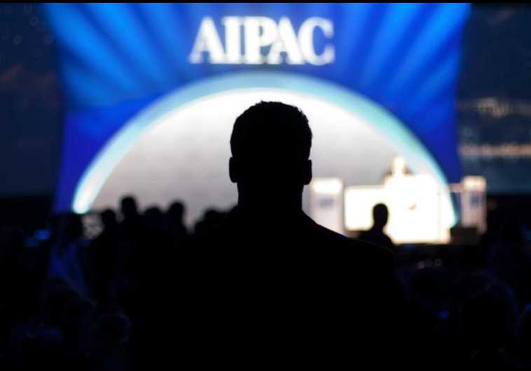 A man waits for the start of the evening's speeches at the American Israel Public Affairs Committee (AIPAC) policy conference in Washington