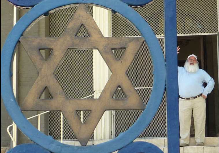The Windhoek Hebrew Congregation synagogue in Namibia, with community leader Zvi Gorelick in the background.