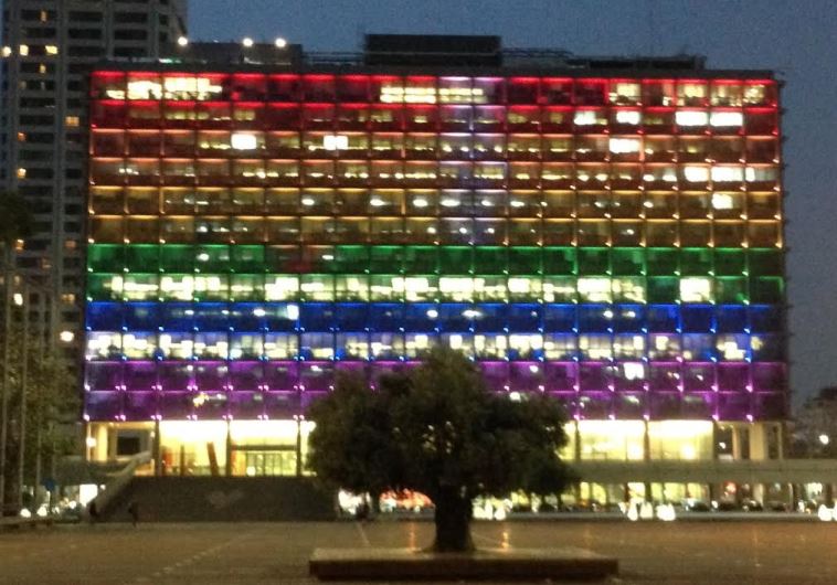 Tel Aviv Municpality building lit up in rainbow colors symbolizing LGBT pride