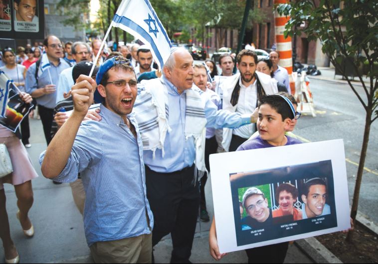 Rabbi Avi Weiss (center) during a memorial service last year near the United Nations headquarters for Eyal Yifrach, Gil-Ad Shaer and Naftali Fraenkel.