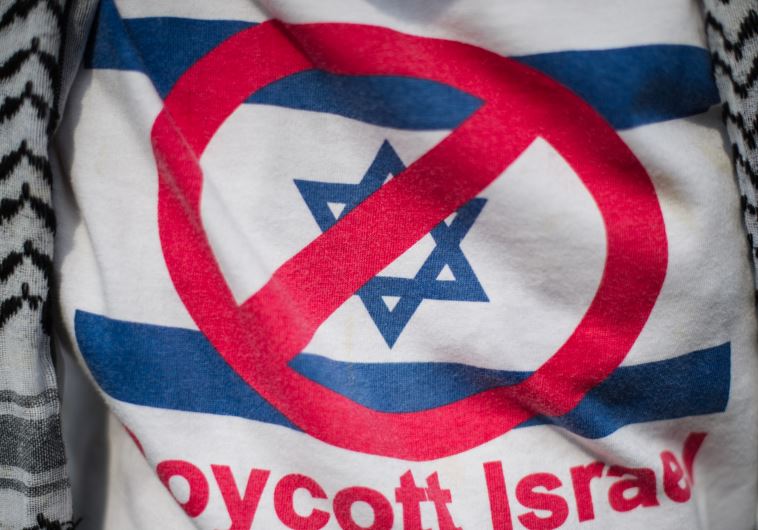 A demonstrator wears a shirt reading 'Boycott Israel' [File]