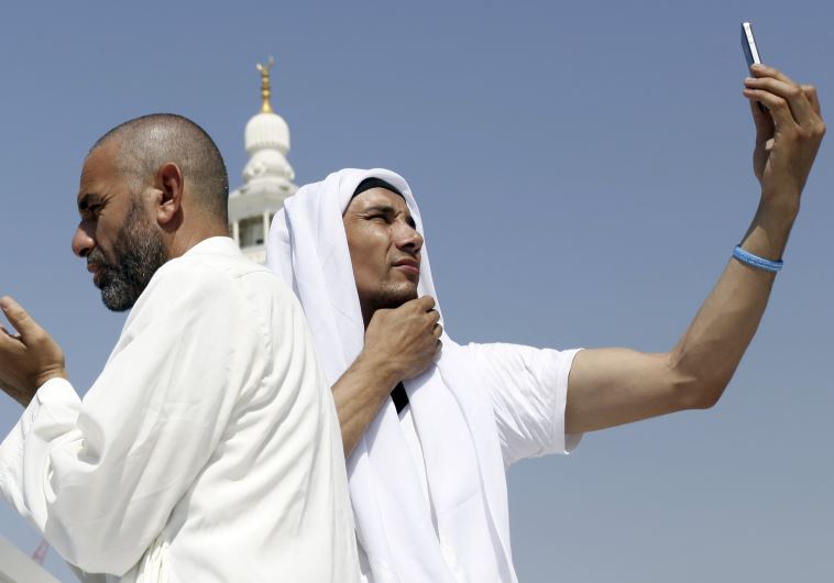 Man takes a selfie in Meeca, Saudi Arabia