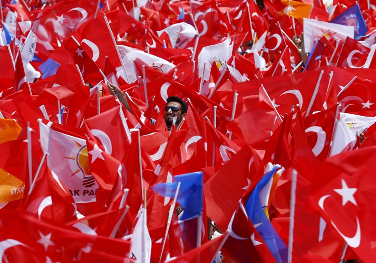 Supporters of the ruling AK Party wave Turkish national and party flags at an election rally for Turkey's June 7 parliamentary election, in Antalya, Turkey, June 6, 2015