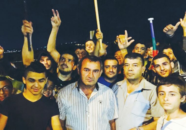 JABER HAMOUD (second left), head of the Druse and Circassian Local Councils Forum, protests in Sajur Sunday. 