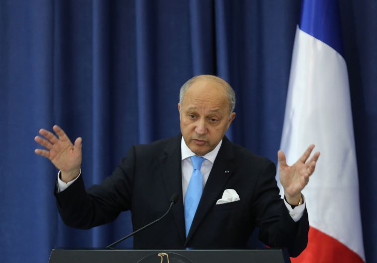 French Foreign Minister Laurent Fabius gestures during a press conference at the Mukataa compound, in the West Bank city of Ramallah, on June 21, 2015. 