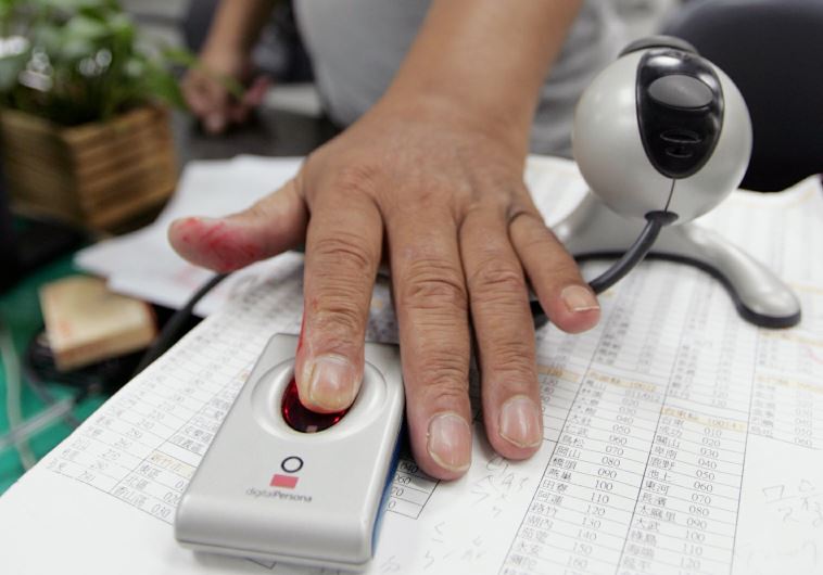 A man has his fingerprint scanned [file]