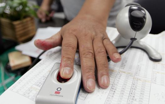 A man has his fingerprint scanned [file]
