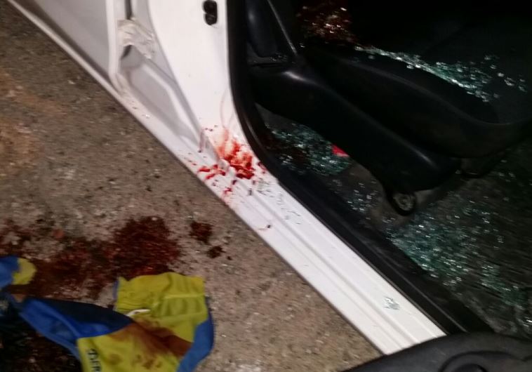 Vehicle with bullet hole punctures on the scene of a shooting attack in the West Bank, June 29, 2015.