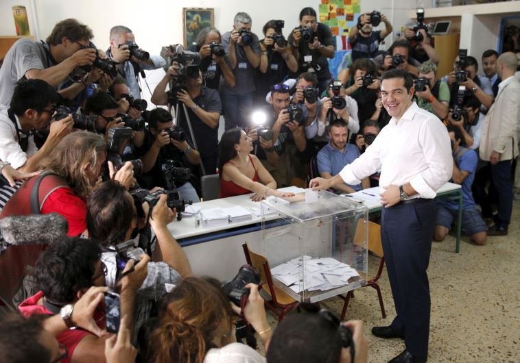Greek Prime Minister Alexis Tsipras votes at a polling station in Athens, Greece July 5, 2015.