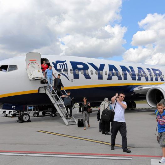 File photo of passangers leaving a Ryanair aircraft at Modlin airport near Warsaw, Poland June 26, 2014. 