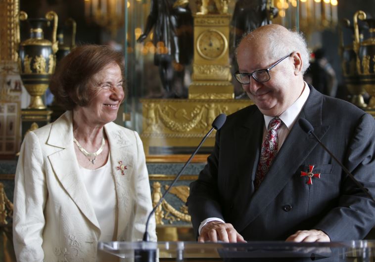Nazi hunters Beate Klarsfeld and her husband Serge Klarsfeld react after being awarded by German ambassador