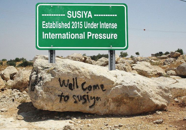 WILL THIS be the new sign greeting visitors to Susiya? The authors argues the Palestinian narrative is based on false information. 