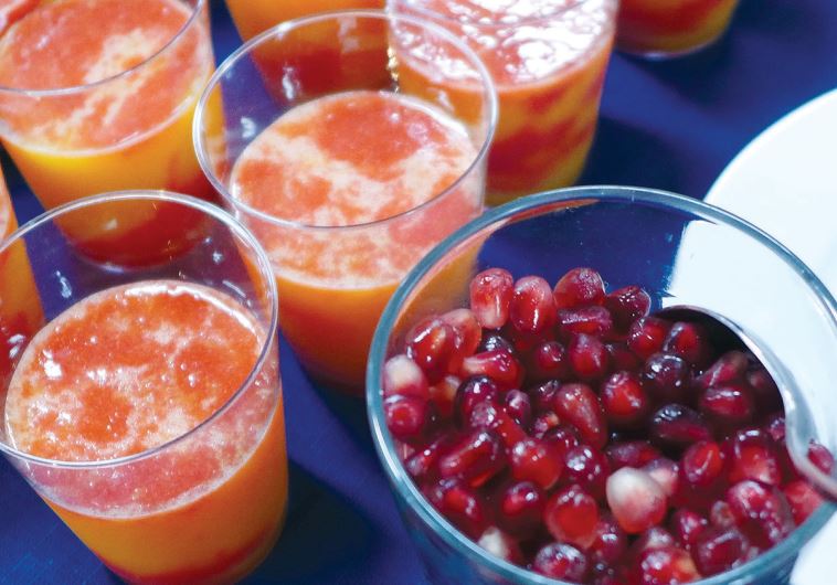 ‘Fruit cocktail’ with fresh pomegranate seeds, strawberries, orange juice and sugar.