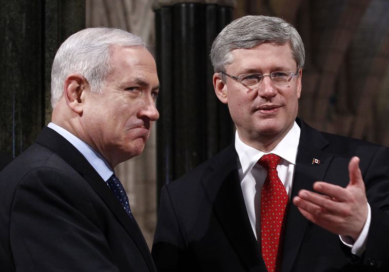 Canada's Prime Minister Stephen Harper (R) shakes hands with Prime Minister Benjamin Netanyahu in Ottawa
