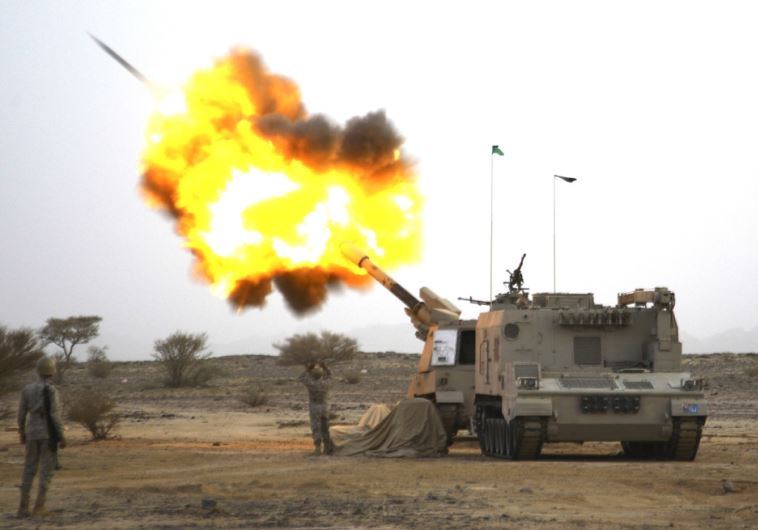 Saudi artillerymen at the border with Yemen fire at Houthi positions