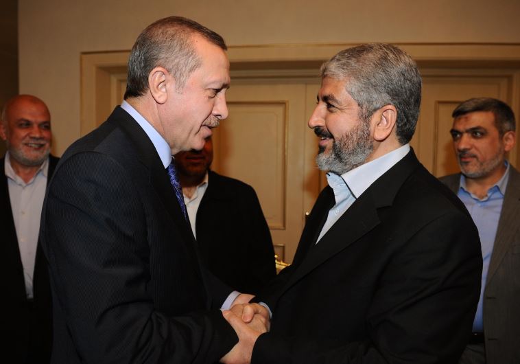 Turkey's Recep Tayyip Erdogan shakes hands with Hamas leader Khaled Mashaal [File]