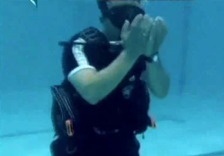 Iranian pray underwater