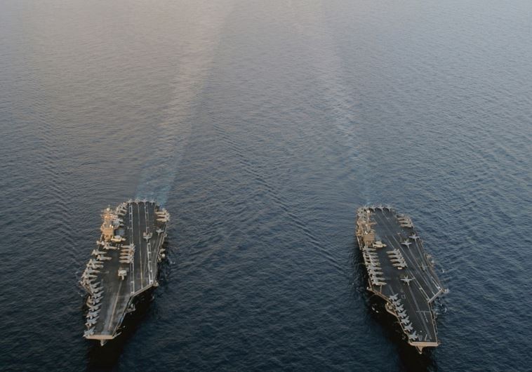 THE NIMITZ-CLASS aircraft carriers USS Abraham Lincoln and USS John C. Stennis plod their way through the Persian Gulf in 2012. ‘Obama’s aversion to launching a preemptive attack on Iran’s nuclear sites is the result of America’s bitter experiences in Afghanistan and Iraq and Obama’s herculean effor
