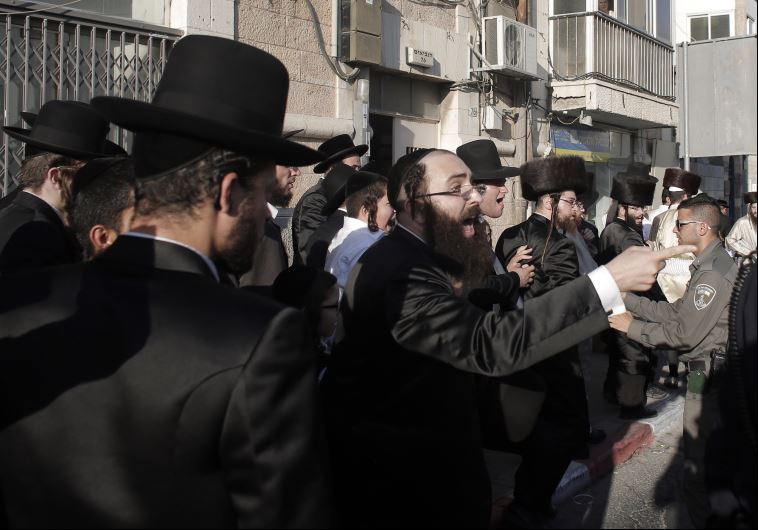 Police break up a demonstration by Ultra-Orthodox Jews against the desecration of the Sabbath in central Jerusalem