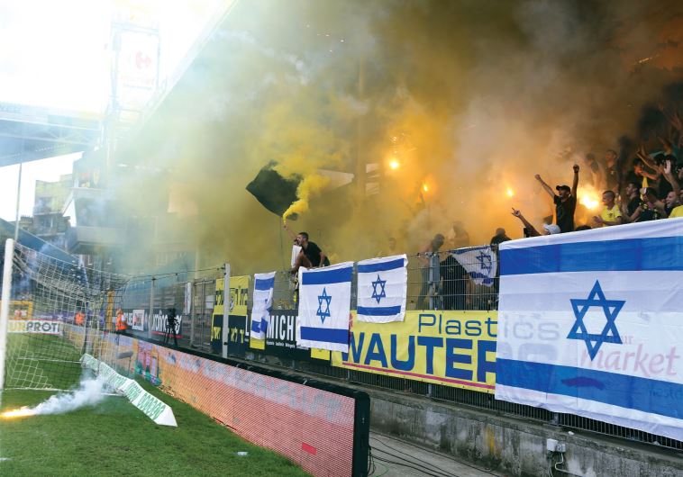 Jerusalem supporters from the La Familia fan group hold up a match against Charleroi in Belgium