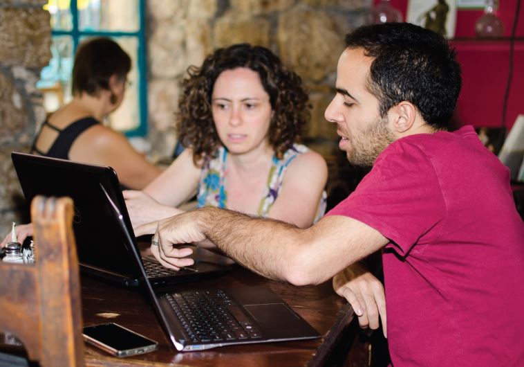 Deena Levenstein (left) gets ready to tap away on her laptop in Tmol Shilshom’s new hub