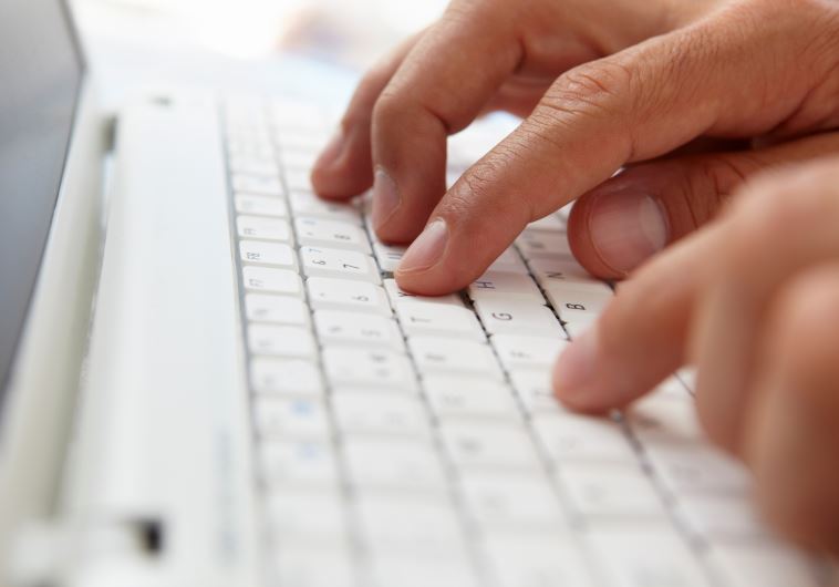Writing on a computer keyboard [Illustrative]