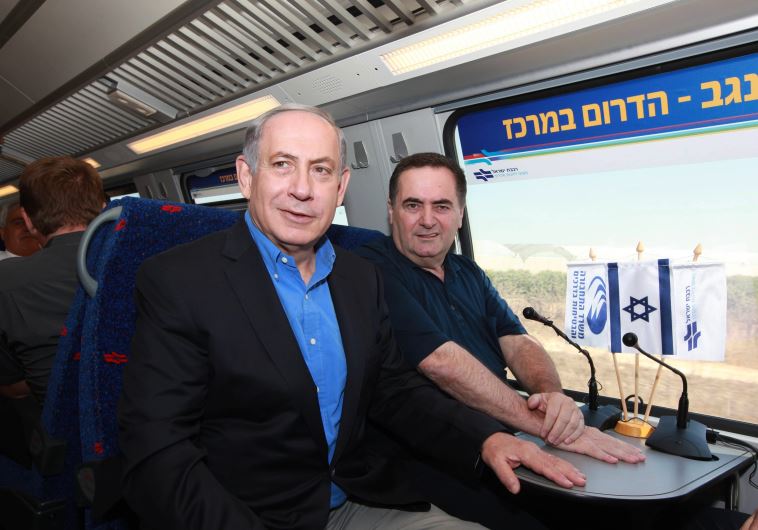 Prime Minister Benjamin Netanyahu and Transportation Minister Yisrael Katz ride an Israel Railways train