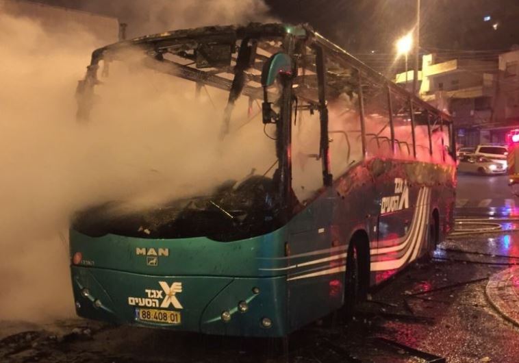 Israeli bus that went up in flames after being struck by a Molotov cocktail in Ras el-Amoud
