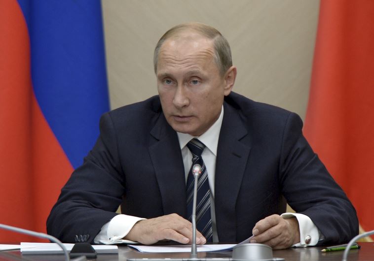 Russian President Vladimir Putin chairs a meeting with members of the government at the Novo-Ogaryovo state residence outside Moscow