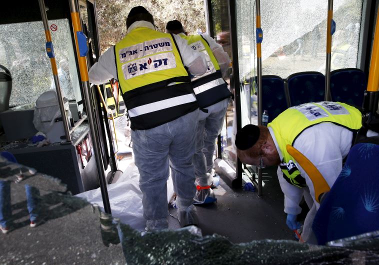 Members of Zaka Rescue and Recovery team at the scene of terror attack in Armon Hanatziv, Jerusalem