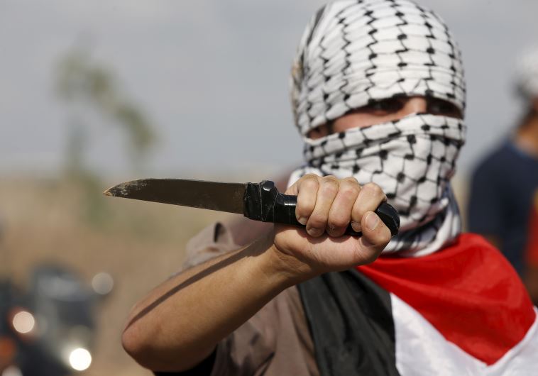 A Palestinian holding a knife in Hebron