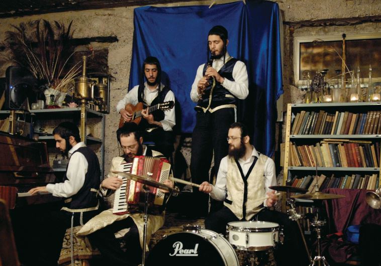 Avrum Lieb Burstein plays the accordion with a klezmer band at Burstein’s Krechme