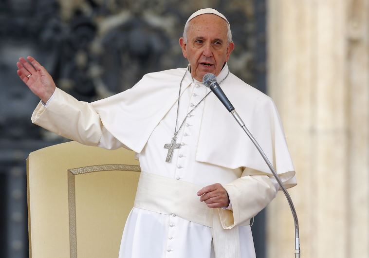 Pope Francis talks as he leads the weekly audience in Saint Peter's Square at the Vatican 